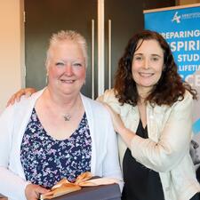 Female retiree poses with female principal
