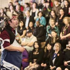 Councillor Chris Silver speaks to the attendees in the longhouse